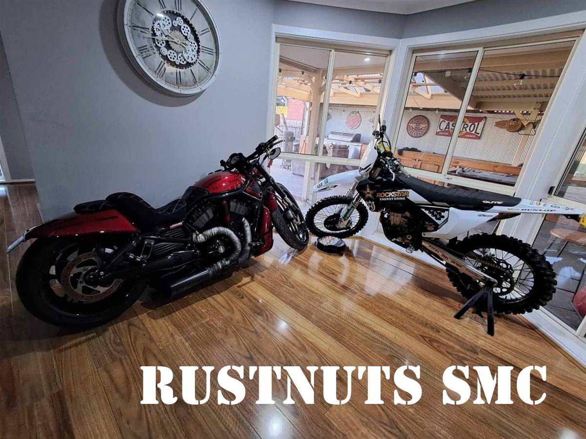 Rustnuts SMC motorcycles lined up at a meet